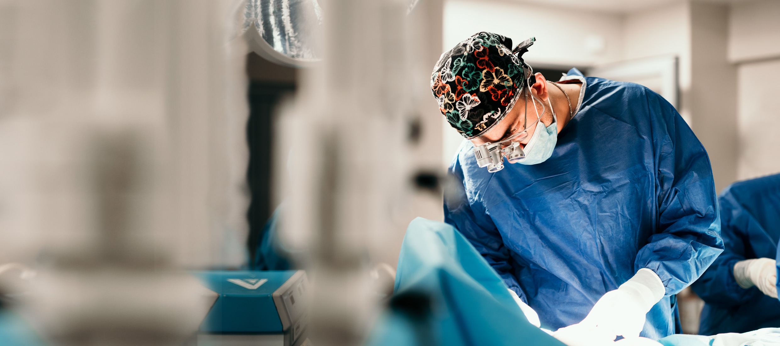 Doctor wearing surgical scrubs in an operating room