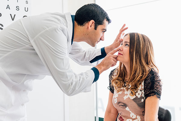 Young woman having her eyes examined by an eye doctor.